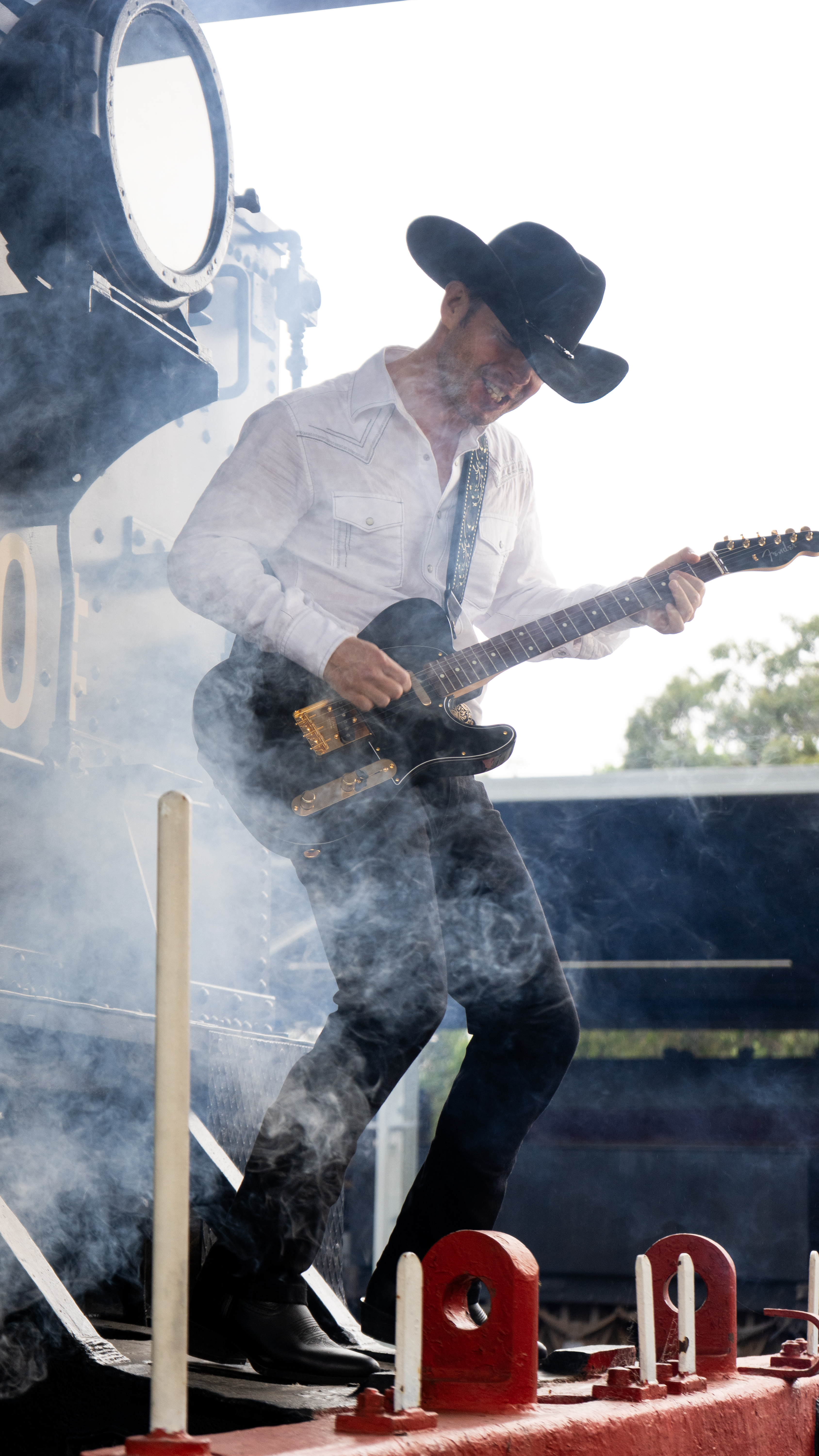 Kincade Stevens performing with electric guitar in steam